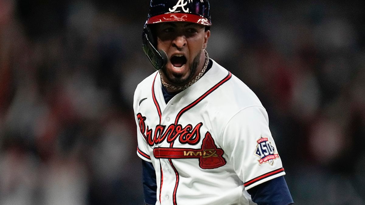Atlanta Braves' Eddie Rosario celebrates after hitting a three run home run during the fourth...