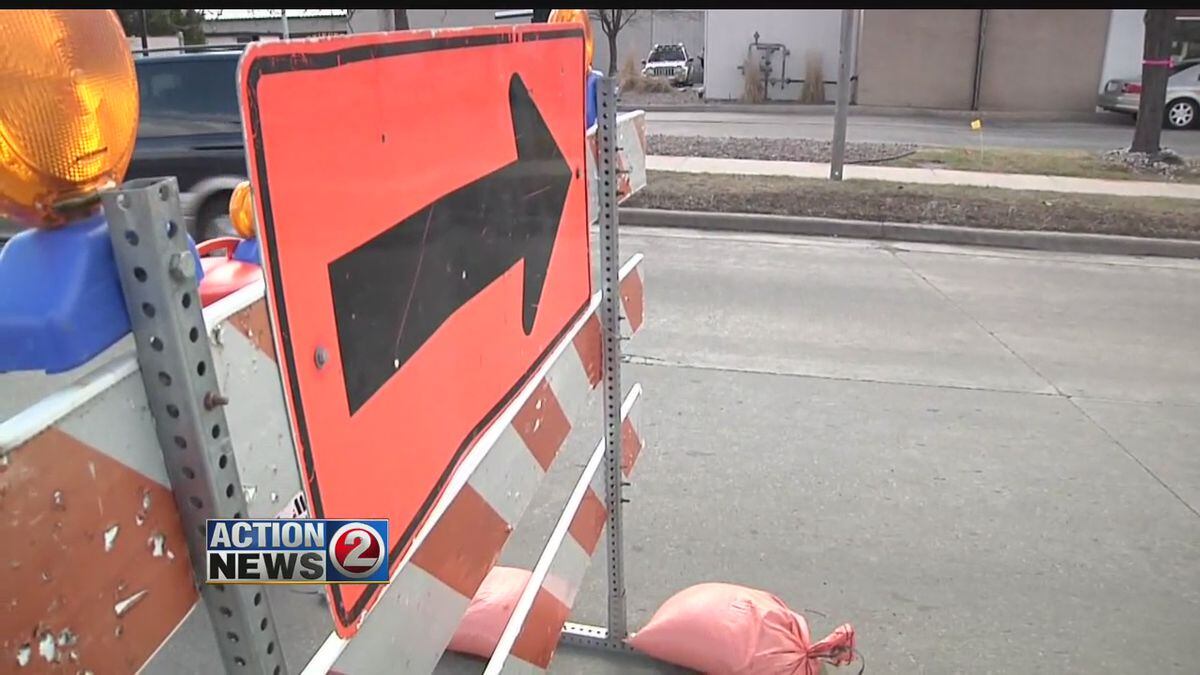 Detour sign on road barricade
