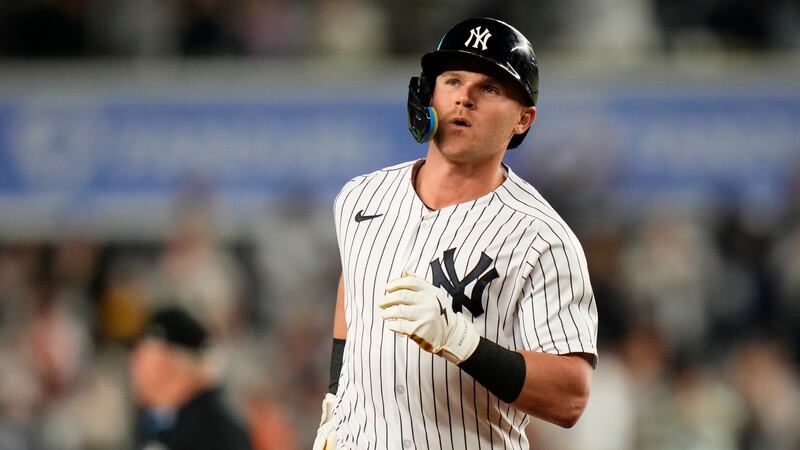FILE - New York Yankees' Jake Bauers runs the bases after hitting a three-run home run during...
