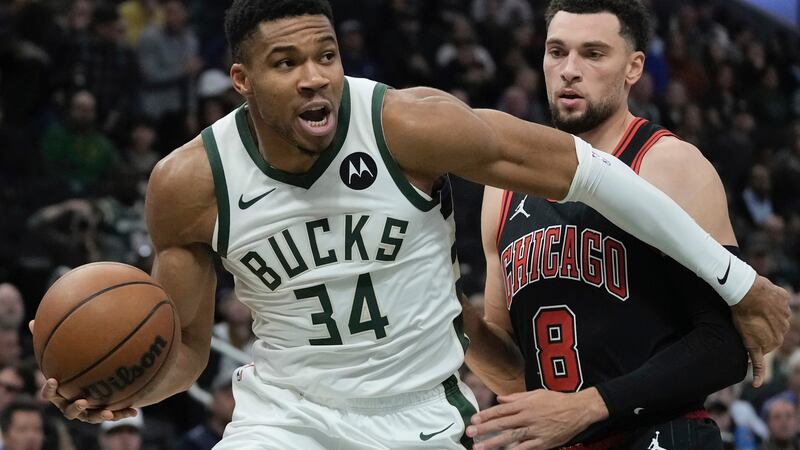Milwaukee Bucks' Giannis Antetokounmpo drives past Chicago Bulls' Zach LaVine during the first...