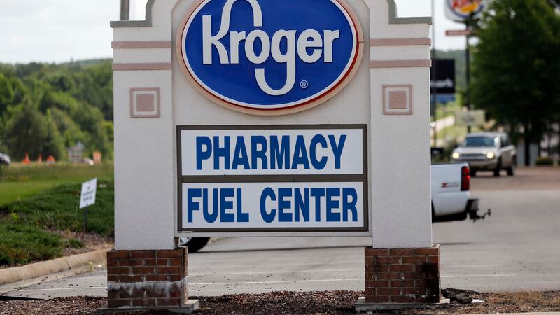 FILE - A Kroger grocery store sign promotes its pharmacy and fuel center at its Flowood,...