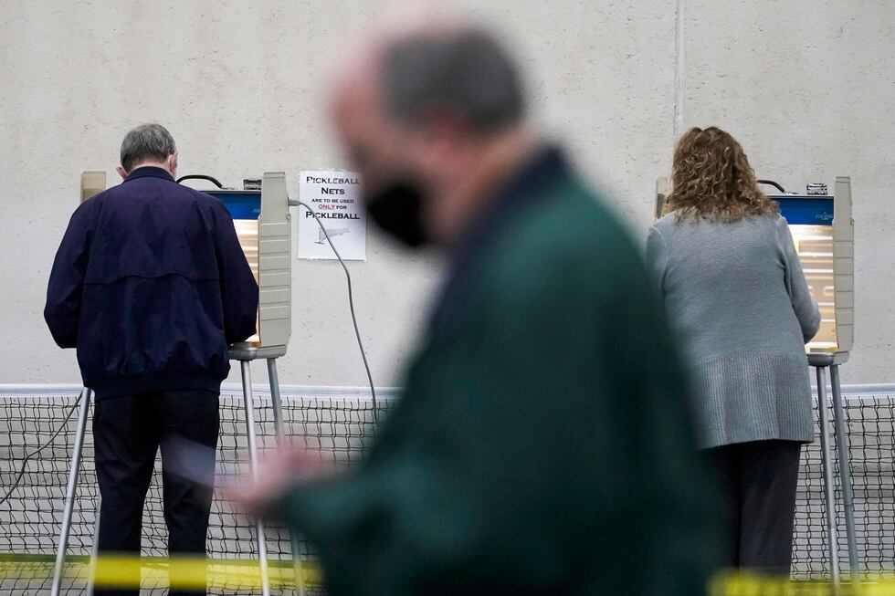 FILE - People vote at the Milwaukee County Sports Complex, Nov. 3, 2020, in Franklin, Wis. A...