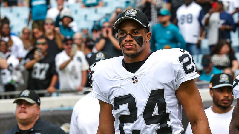Las Vegas Raiders safety Johnathan Abram (24) jogs onto the field to for an NFL football game...