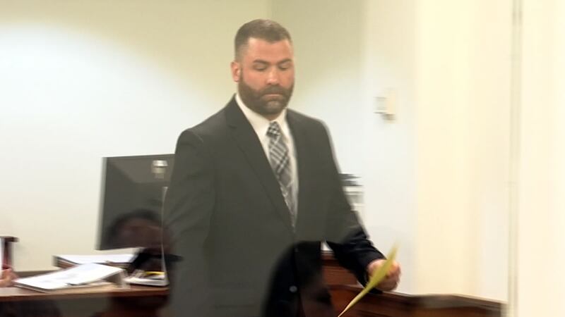 Green Bay Police Officer Matthew Knutson appears in Brown County court on charges that he hit...