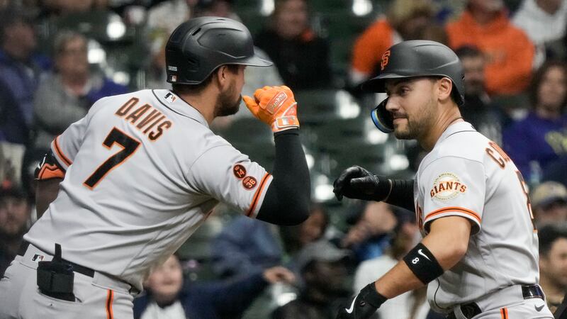 San Francisco Giants' Michael Conforto celebrates his home run with teammate J.D. Davis during...
