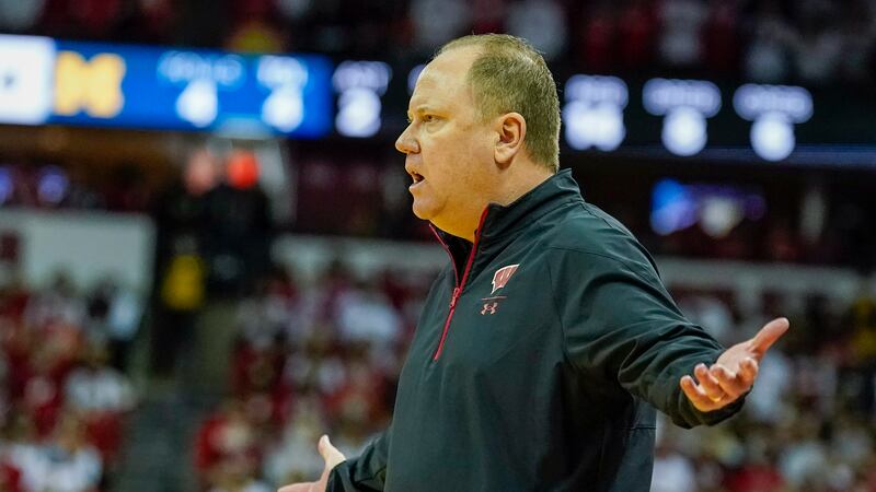 Wisconsin head coach Greg Gard disputes a call during the first half of an NCAA college...