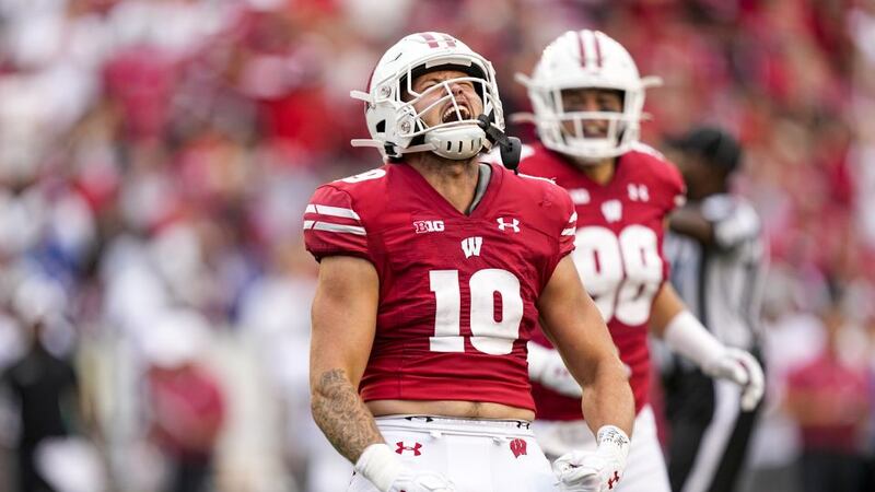 Wisconsin linebacker Nick Herbig (19) celebrates after sacking Washington State quarterback...