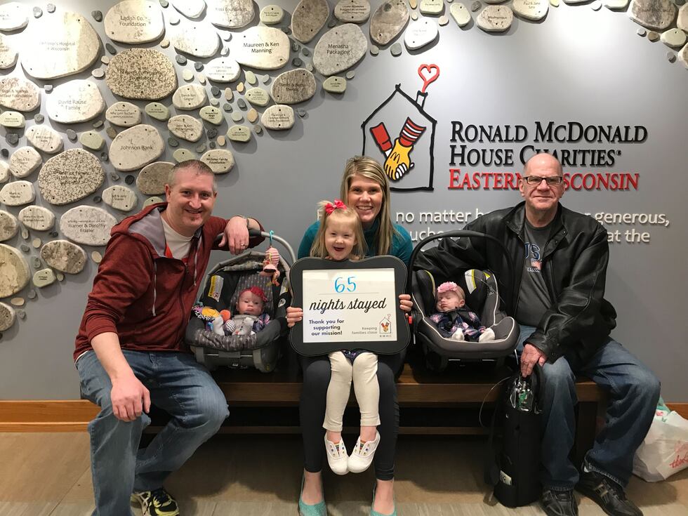 Action 2 News reporter Kristyn Allen (center) marks the end of her family's stay at Ronald...