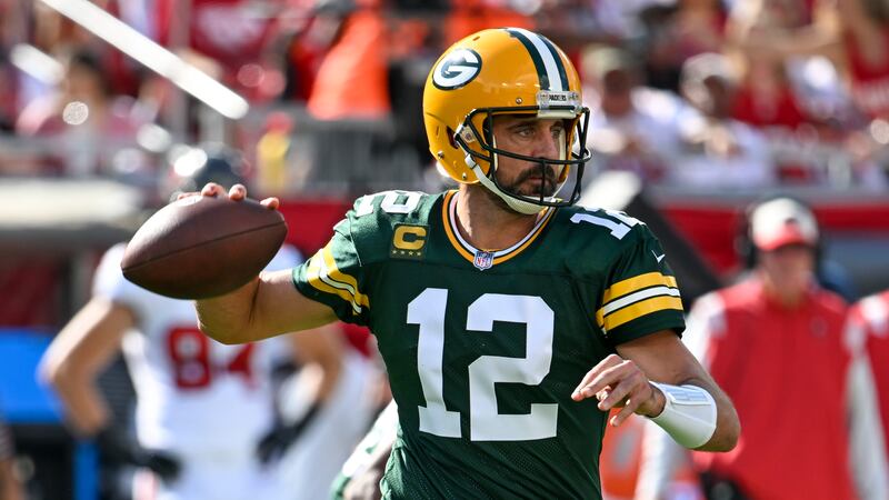 Green Bay Packers' Aaron Rodgers thorws during the first half of an NFL football game against...