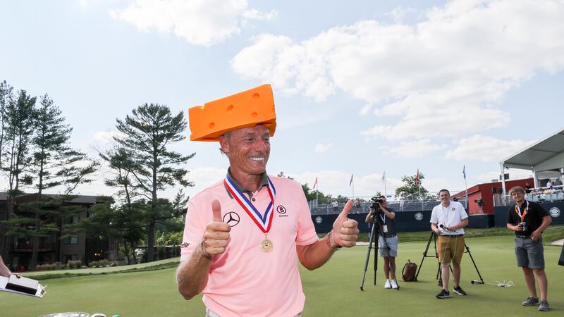 Bernhard Langer wears a cheesehead hat after is two-stroke win at the 2023 U.S. Senior Open at...