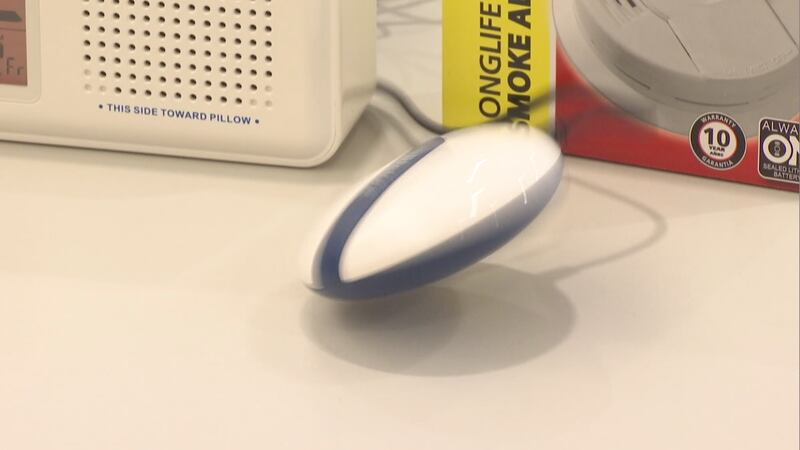 A device that vibrates wildly when triggered by a smoke alarm can be placed under a pillow to...
