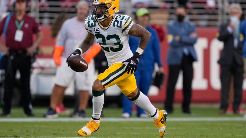 Green Bay Packers cornerback Jaire Alexander (23) runs with an interception during the first...