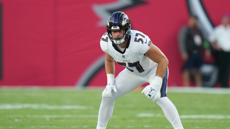 Baltimore Ravens linebacker Kristian Welch (57) waits for a kick-off during an NFL preseason...