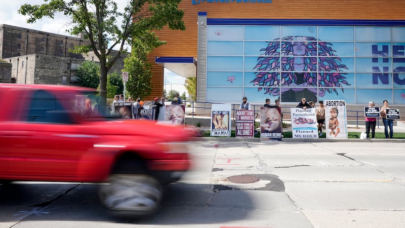 FILE - Protesters are seen outside Planned Parenthood, Sept. 18, 2023, in Milwaukee. On...