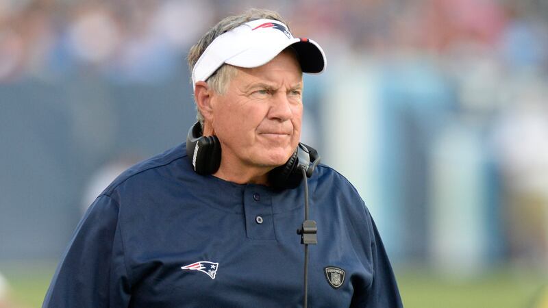 New England Patriots head coach Bill Belichick watches the action in the first half of a...