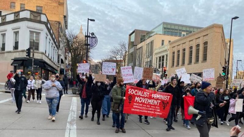 Hundreds of people gathered on the steps of the Wisconsin Capitol Building Tuesday evening,...