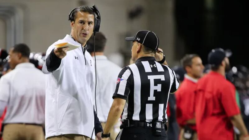 Cincinnati Bearcats head coach Luke Fickell, left, speaks with an official in the third...